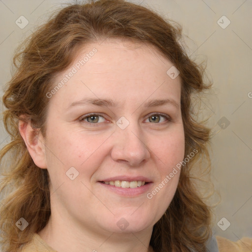 Joyful white young-adult female with medium  brown hair and blue eyes