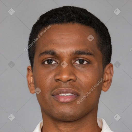 Joyful black young-adult male with short  brown hair and brown eyes