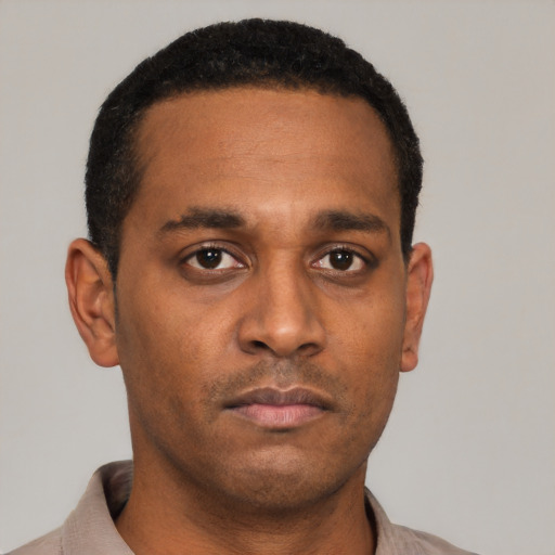 Neutral black young-adult male with short  black hair and brown eyes