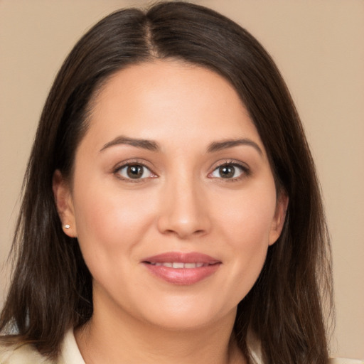 Joyful white young-adult female with long  brown hair and brown eyes