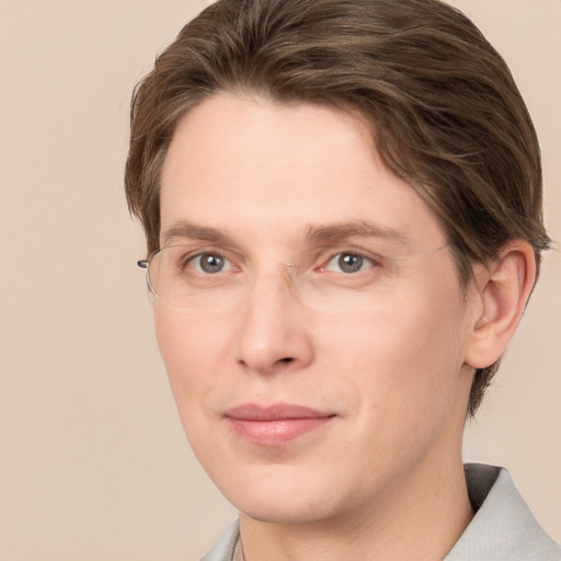 Joyful white young-adult male with medium  brown hair and brown eyes