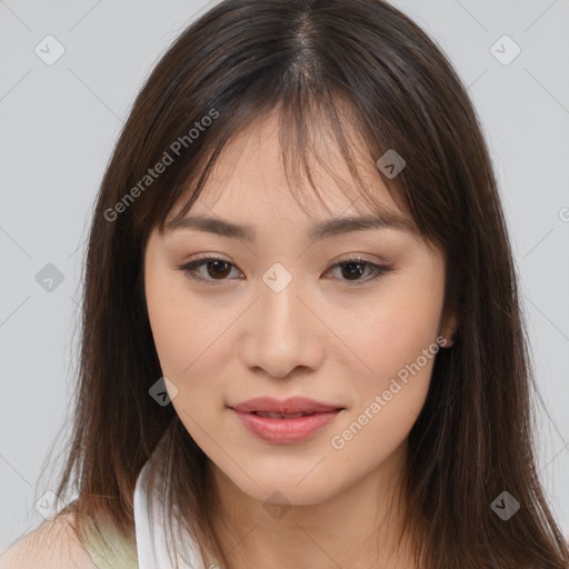 Joyful asian young-adult female with long  brown hair and brown eyes