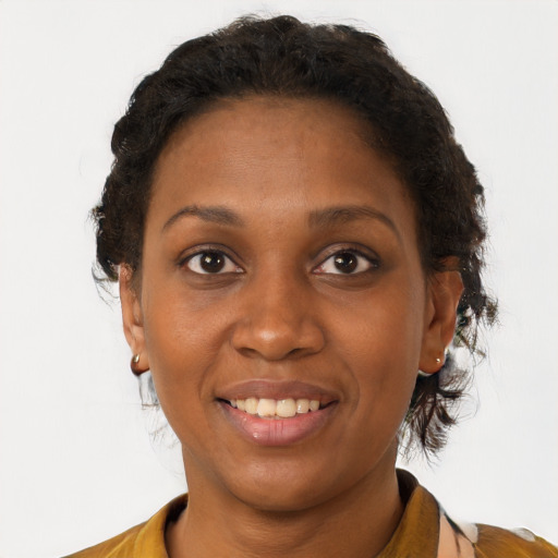 Joyful black young-adult female with short  brown hair and brown eyes