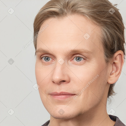 Joyful white adult male with short  brown hair and grey eyes