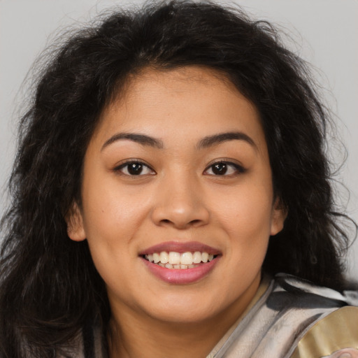 Joyful asian young-adult female with long  brown hair and brown eyes