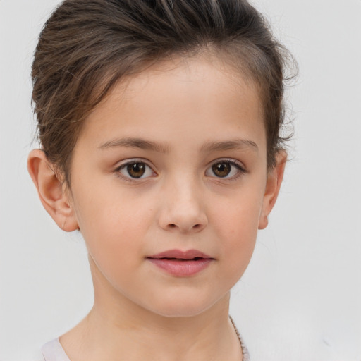 Joyful white child female with short  brown hair and brown eyes