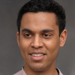 Joyful latino young-adult male with short  black hair and brown eyes