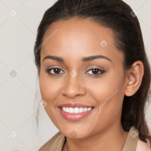 Joyful latino young-adult female with long  brown hair and brown eyes