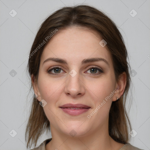 Joyful white young-adult female with medium  brown hair and grey eyes