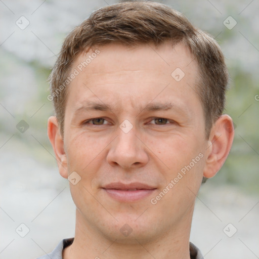 Joyful white adult male with short  brown hair and grey eyes