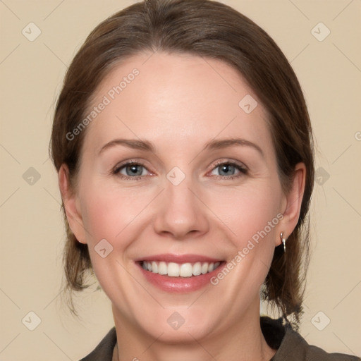 Joyful white young-adult female with medium  brown hair and grey eyes