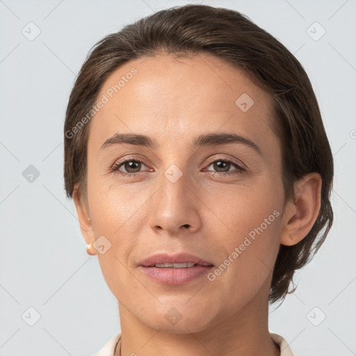 Joyful white adult female with short  brown hair and brown eyes