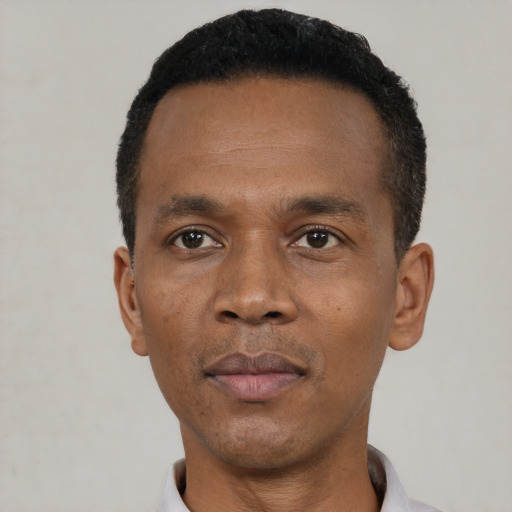 Neutral black adult male with short  black hair and brown eyes