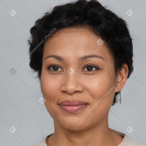 Joyful latino adult female with short  brown hair and brown eyes