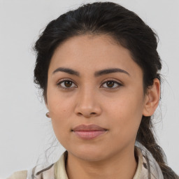 Joyful asian young-adult female with medium  brown hair and brown eyes