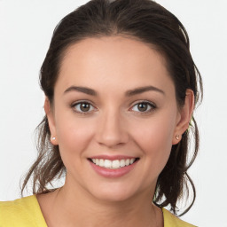 Joyful white young-adult female with medium  brown hair and brown eyes