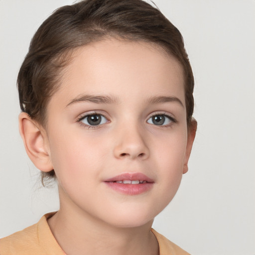 Joyful white child female with short  brown hair and brown eyes