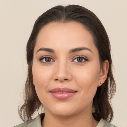 Joyful white young-adult female with medium  brown hair and brown eyes