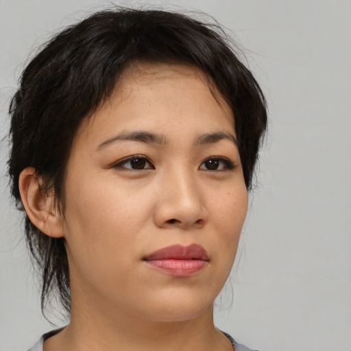 Neutral asian young-adult female with medium  brown hair and brown eyes