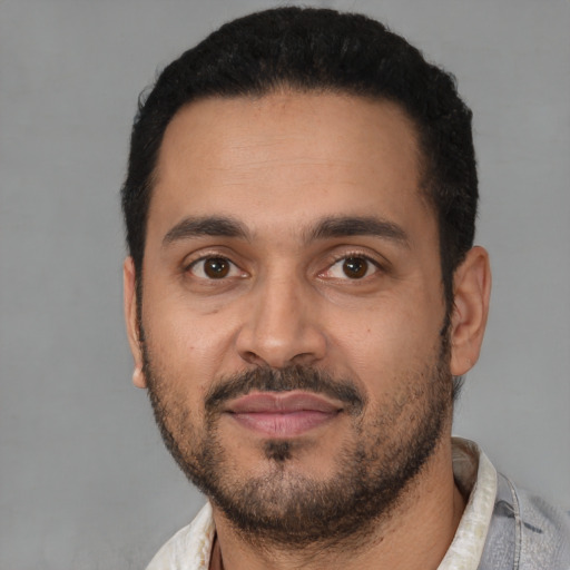 Neutral latino young-adult male with short  black hair and brown eyes