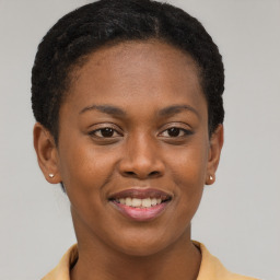 Joyful black young-adult female with short  brown hair and brown eyes