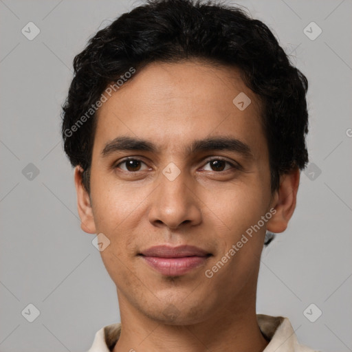 Joyful latino young-adult male with short  brown hair and brown eyes