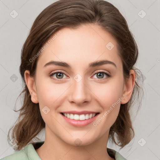 Joyful white young-adult female with medium  brown hair and green eyes