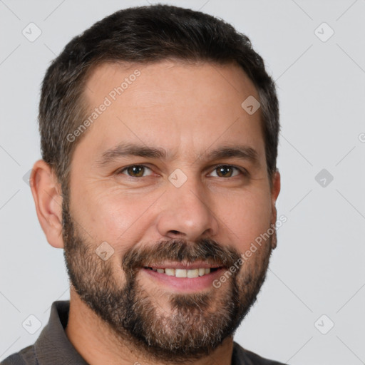 Joyful white adult male with short  brown hair and brown eyes