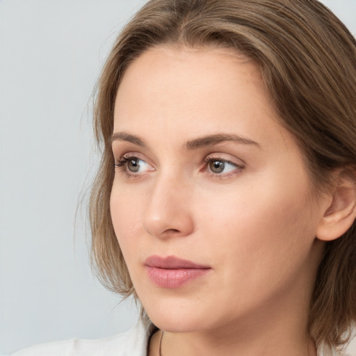 Neutral white young-adult female with medium  brown hair and brown eyes