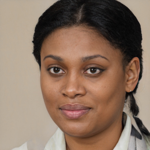 Joyful black young-adult female with medium  brown hair and brown eyes