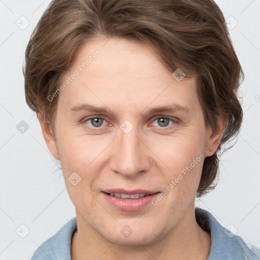 Joyful white adult female with short  brown hair and grey eyes