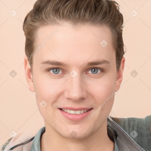 Joyful white young-adult male with short  brown hair and grey eyes