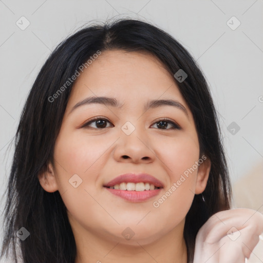 Joyful asian young-adult female with long  brown hair and brown eyes