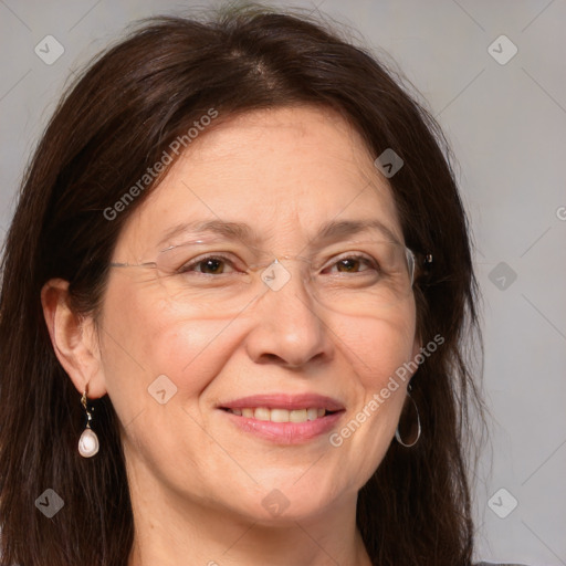 Joyful white adult female with medium  brown hair and brown eyes