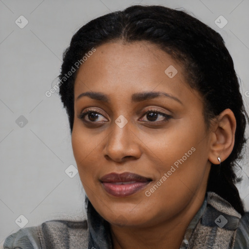 Joyful black young-adult female with medium  black hair and brown eyes