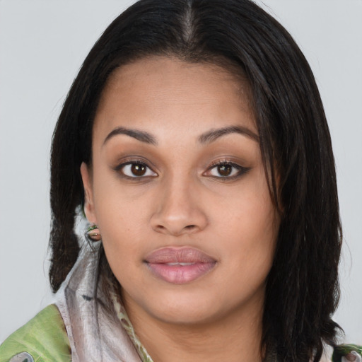Joyful latino young-adult female with long  brown hair and brown eyes