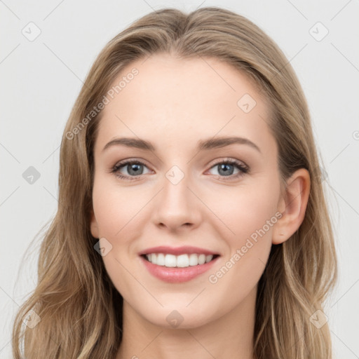 Joyful white young-adult female with long  brown hair and blue eyes