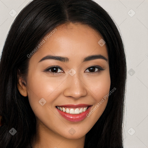 Joyful latino young-adult female with long  brown hair and brown eyes