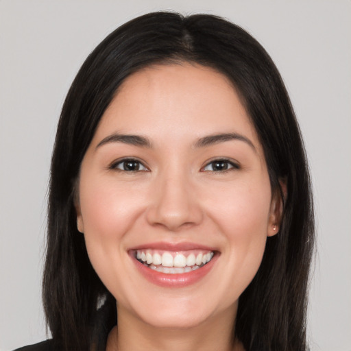 Joyful white young-adult female with long  black hair and brown eyes