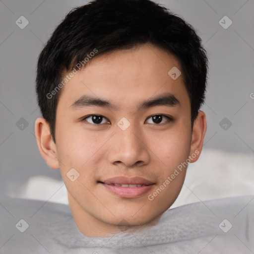 Joyful asian young-adult male with short  black hair and brown eyes
