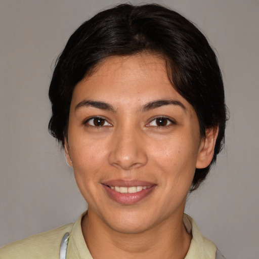 Joyful white young-adult female with medium  brown hair and brown eyes