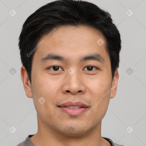 Joyful asian young-adult male with short  black hair and brown eyes