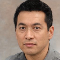 Neutral asian adult male with short  black hair and brown eyes