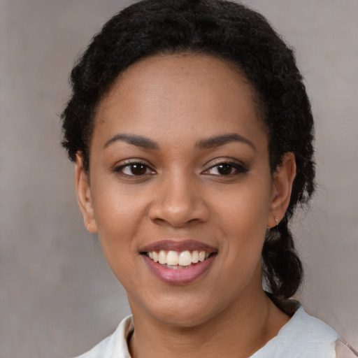 Joyful latino young-adult female with medium  black hair and brown eyes