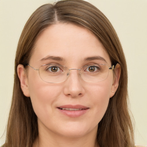 Joyful white adult female with long  brown hair and brown eyes