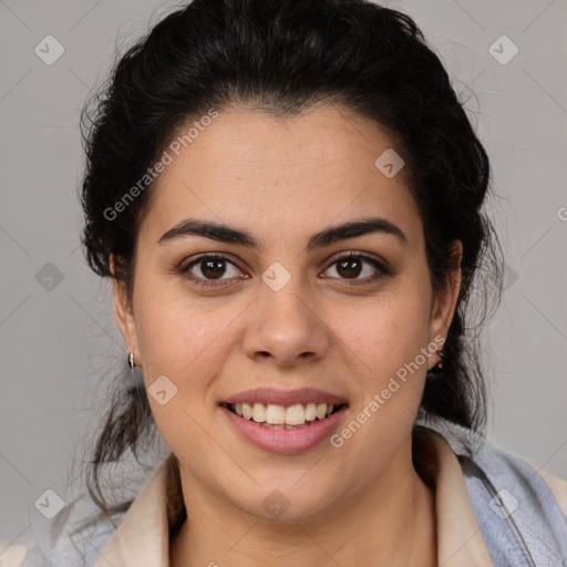 Joyful latino young-adult female with medium  brown hair and brown eyes