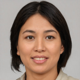 Joyful white young-adult female with medium  brown hair and brown eyes