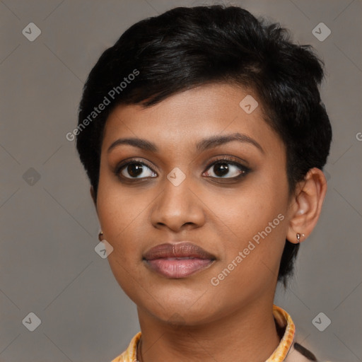 Joyful black young-adult female with short  black hair and brown eyes