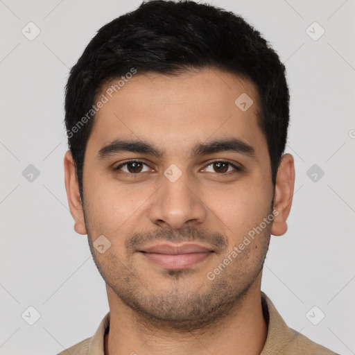 Joyful latino young-adult male with short  black hair and brown eyes