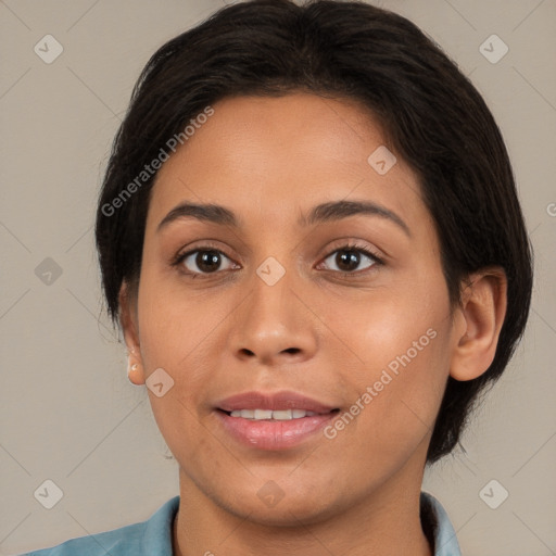 Joyful latino young-adult female with medium  brown hair and brown eyes